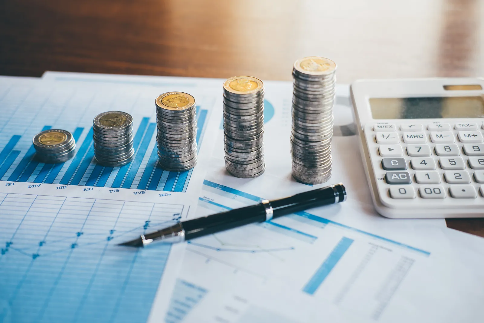 Financial Chart with Coins pen and calculator